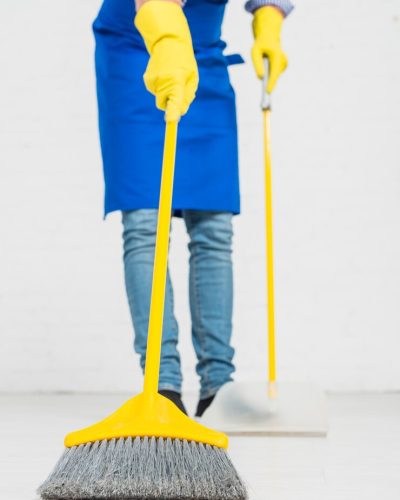 close-up-man-cleaning-his-house_23-2148112805